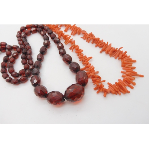 692 - A string of cherry amber coloured beads, weight 32.1gms, largest bead approx 21.5mm x 16.4mm and a s... 