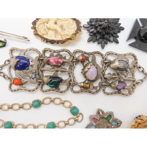 693 - An early Butler & Wilson fish bracelet, a Sarah Coventry brooch, a Miracle pendant and other ite... 