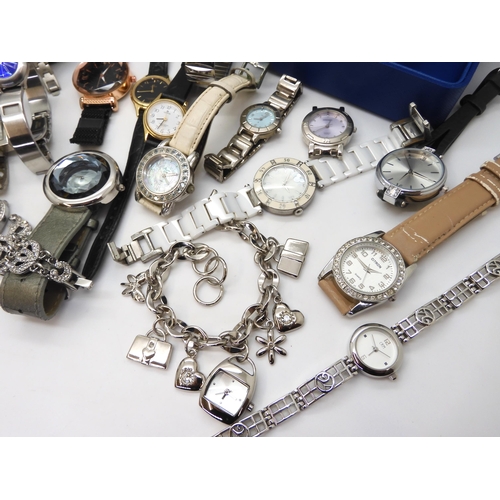 695 - A collection of fashion watches to include Storm, a Mackintosh style watch, traveling clock in the s... 