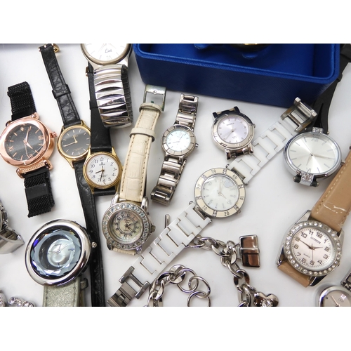 695 - A collection of fashion watches to include Storm, a Mackintosh style watch, traveling clock in the s... 