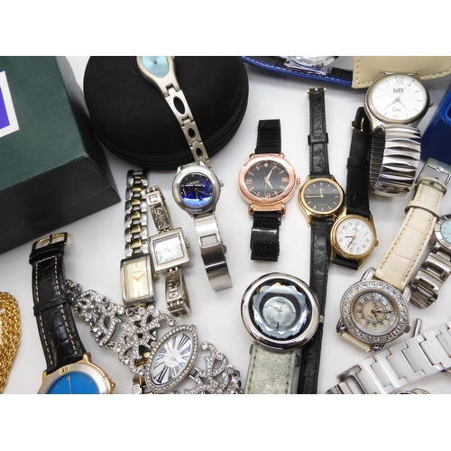 695 - A collection of fashion watches to include Storm, a Mackintosh style watch, traveling clock in the s... 