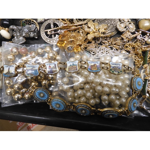 700 - A large collection of vintage costume jewellery to include, pearls, vintage beads, brooches a souven... 