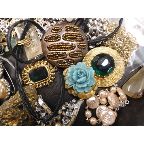 700 - A large collection of vintage costume jewellery to include, pearls, vintage beads, brooches a souven... 