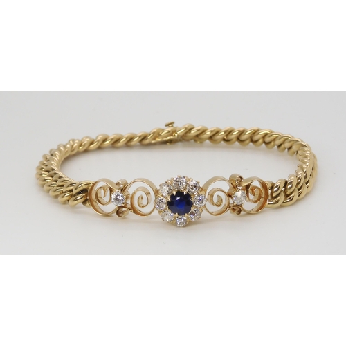 2796 - A SAPPHIRE AND DIAMOND FLOWER BRACELETset throughout in bright yellow metal, with diamond and sapphi... 