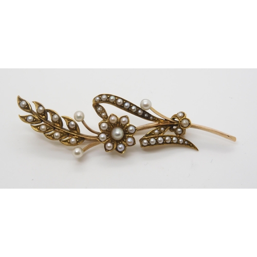 2799 - TWO VINTAGE PEARL BROOCHESto include a crescent moon brooch, stamped 15ct and set with split pearls ... 