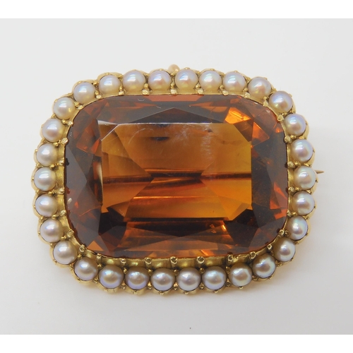 2804 - A 15CT GOLD CITRINE AND PEARL BROOCHset with a 25mm x 18mm x 12mm cognac colour citrine in cut back ... 