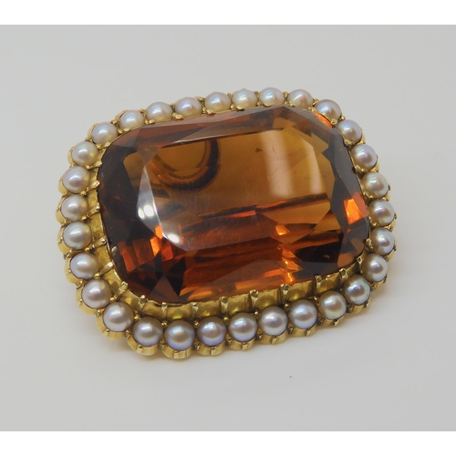 2804 - A 15CT GOLD CITRINE AND PEARL BROOCHset with a 25mm x 18mm x 12mm cognac colour citrine in cut back ... 