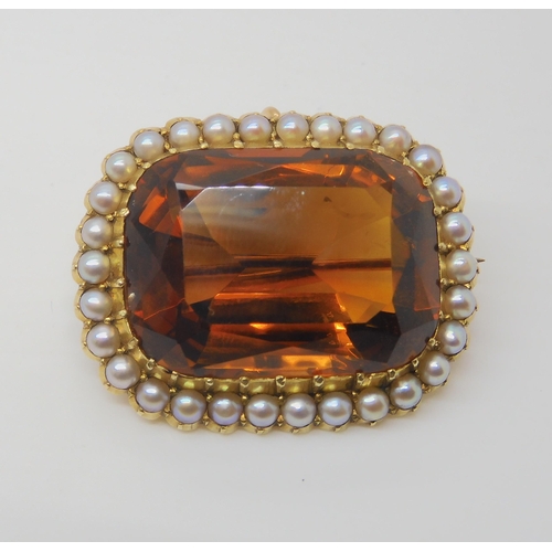 2804 - A 15CT GOLD CITRINE AND PEARL BROOCHset with a 25mm x 18mm x 12mm cognac colour citrine in cut back ... 