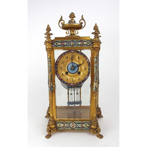 2151 - A FRENCH CHAMPLEVE ENAMEL AND GILT BRASS MANTEL CLOCKwith four glass panels revealing the movement, ... 