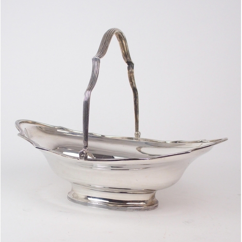 A LATE VICTORIAN SILVER SWING-HANDLED BREAD BASKET