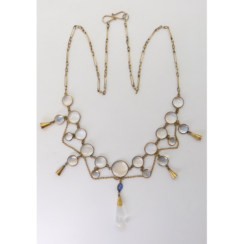 2726 - A MOONSTONE DROP NECKLACEmounted throughout in yellow metal, with spectacle set moonstones and a sap... 