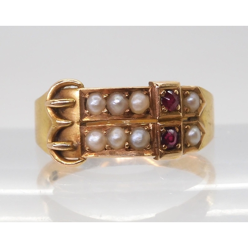 2729 - AN UNUSUAL DOUBLE BUCKLE RINGset with rubies and pearls, with 15ct gold Birmingham 1890 hallmarks. F... 