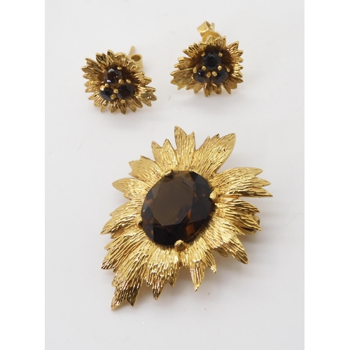 2731 - A RETRO BROOCH AND EARRING SETof 9ct gold leaf forms set with smoky quartz, dimensions of the brooch... 