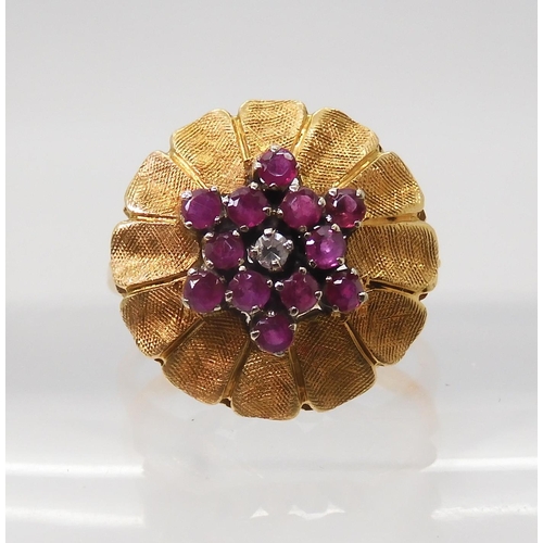 2740 - AN ITALIAN RETRO FLOWER CLUSTER RINGset with rubies and a diamond, mounted throughout in 18ct yellow... 