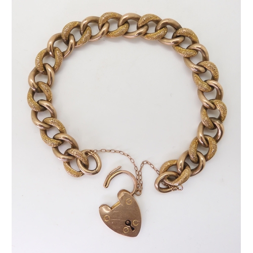 2742 - A 9CT GOLD CURB CHAIN BRACELETwith heart-shaped clasp, hollow construction with alternate links text... 