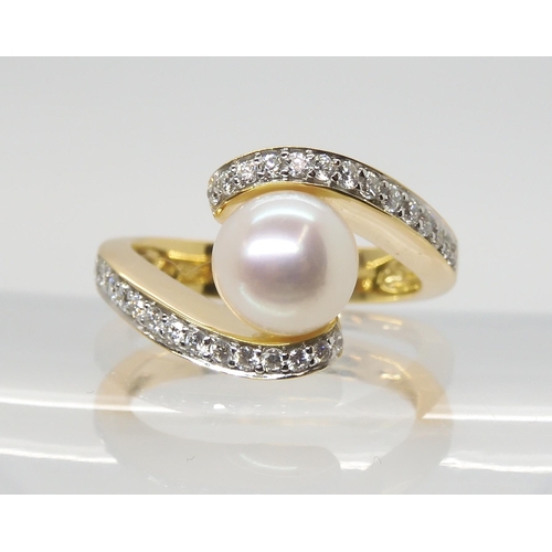 2793 - A DIAMOND AND PEARL RINGmounted in 18ct yellow gold the 7.6mm pearl is flanked with two rows of bril... 