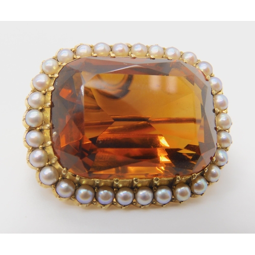 2804 - A 15CT GOLD CITRINE AND PEARL BROOCHset with a 25mm x 18mm x 12mm cognac colour citrine in cut back ... 