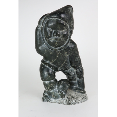 2950 - JOHNNY INUKPUK RCA (CANADIAN 1911-2007)INUK HOLDING ANIMAL Soapstone carving, inscribed indistinctly... 