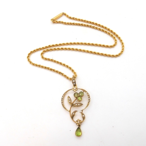 A peridot and pearl Edwardian pendant on a 15ct gold rope chain weight together 10.2gms