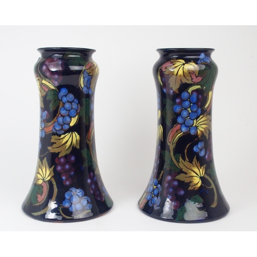 2191 - A PAIR OF ROYAL STANLEY WARE VASES in Jacobean pattern, 31cm high