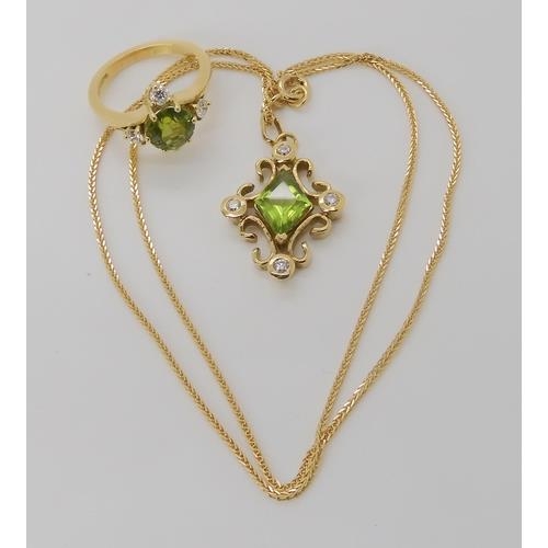 2811 - A BESPOKE PERIDOT & DIAMOND SUITEmounted throughout in 18ct gold, the pendant was designed by Ka... 