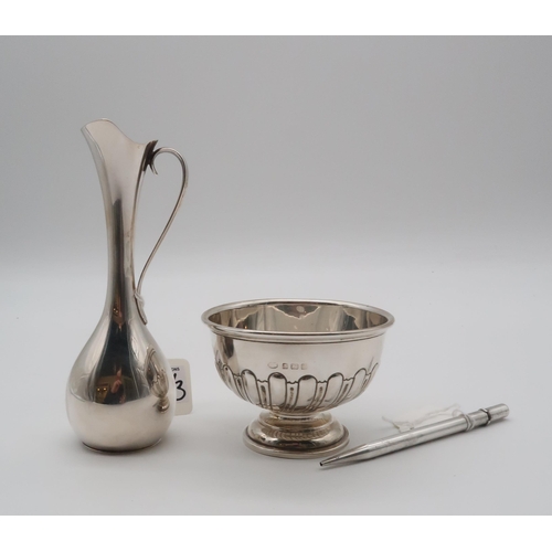 409 - A collection of silver including a footed silver bowl, Birmingham 1934, the body partly fluted, a si... 