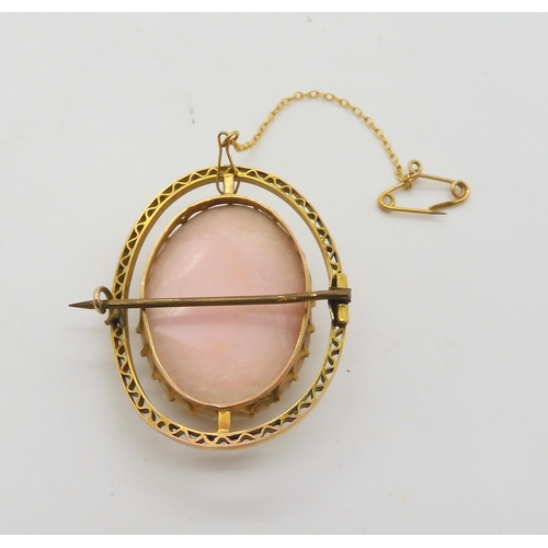 658 - A pink conch shell cameo of a maiden, in a 9ct brooch mount, approx 4cm x 3.2cm, weight 13gms