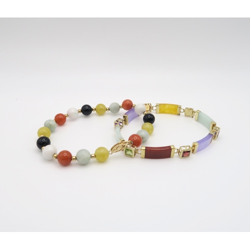 601 - A 14k gold mounted multi coloured hardstone bracelet set with amethyst, citrine, peridot and garnet,... 