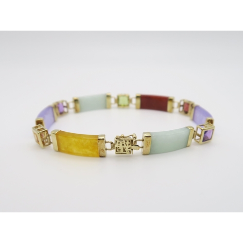 601 - A 14k gold mounted multi coloured hardstone bracelet set with amethyst, citrine, peridot and garnet,... 