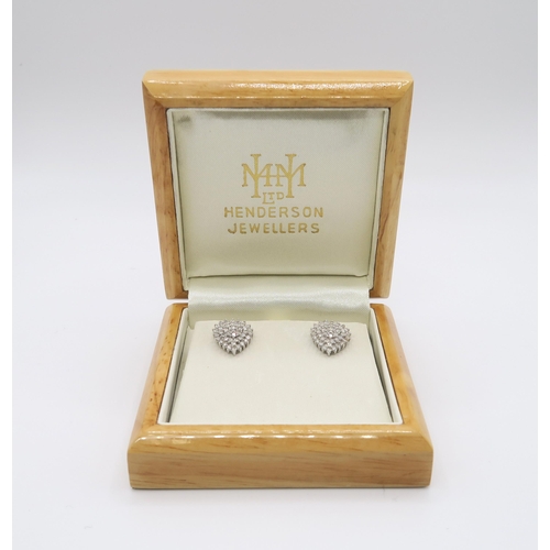 604 - A pair of 18ct gold heart shaped earrings, set with estimated approx of 1ct of brilliant cut diamond... 