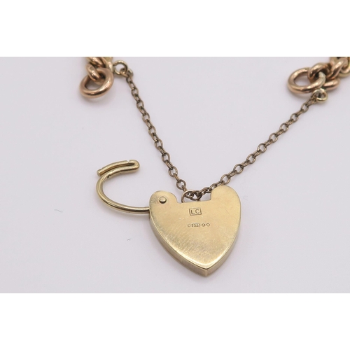 609 - A 9ct rose gold curb chain bracelet with a glass set fob seal and heart shaped clasp, hallmarked .37... 