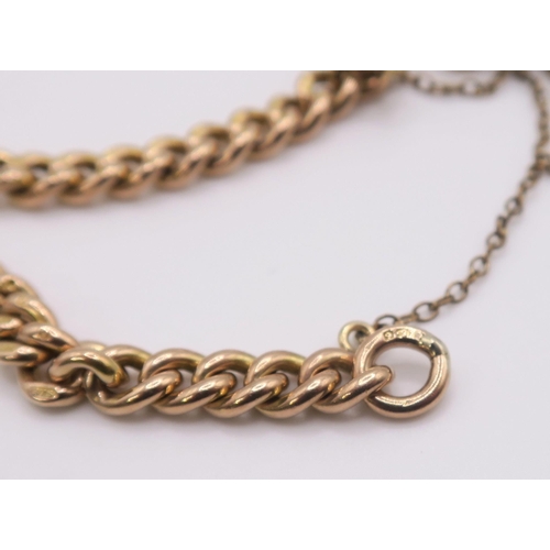 609 - A 9ct rose gold curb chain bracelet with a glass set fob seal and heart shaped clasp, hallmarked .37... 