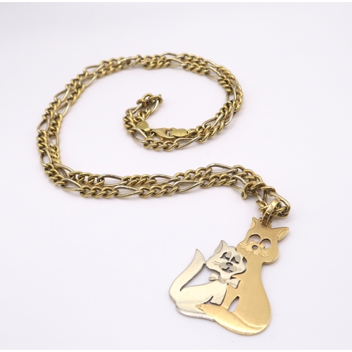 612 - An 18ct gold Italian made Mr & Mrs Pussycat pendant, on a 18ct yellow and white gold figaro chai... 