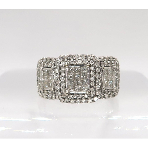 614 - An 18ct white gold diamond cluster ring, set with estimated approx of 1ct of brilliant and princess ... 