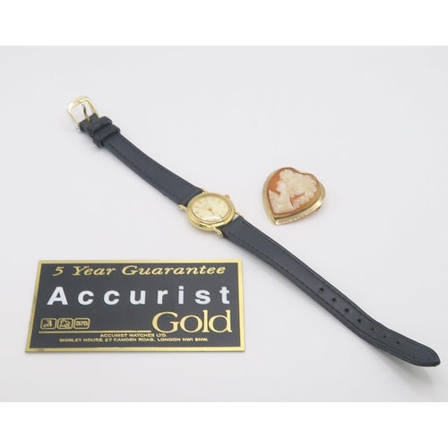 615 - A 9ct gold ladies Ingersoll wristwatch and a Italian made 9ct pendant brooch mounted with a heart sh... 