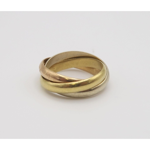 620 - A Cartier 18ct three colour gold 'Trinity Ring' the red gold band stamped 'Les Must De Cartier' inne... 