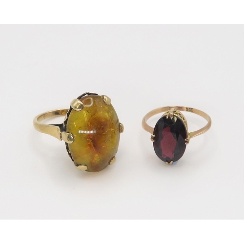 625 - A 9ct gold garnet ring, size P, together with a 9ct amber ring size O, weight together 7.5gms