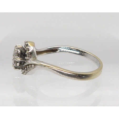 638 - An 18ct white gold diamond flower ring (two diamonds missing) set with estimated approx 0.25cts, fin... 