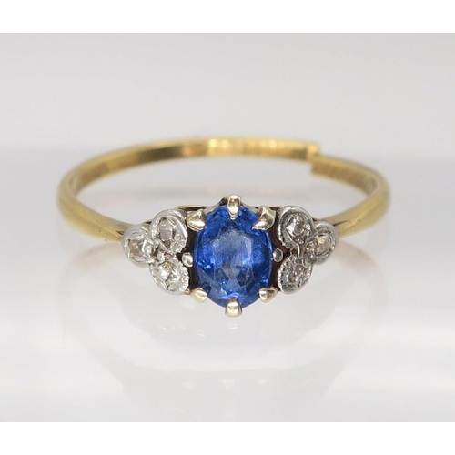 642 - A bright yellow metal sapphire and diamond ring, the central sapphire is approx 5.5mm x 4.3mm x 2.7m... 