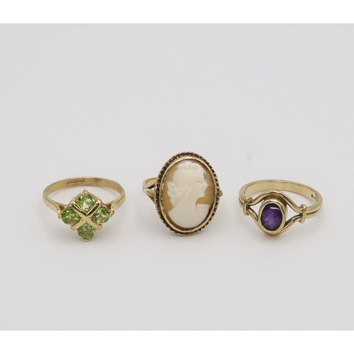 647 - A 9ct ring set with four peridot, size N, a 9ct amethyst ring size M1/2, and a 9ct gold  cameo ... 