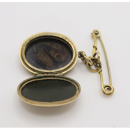 649 - A 10k gold fob brooch, with a back & front yellow metal Victorian locket enclosing hair art, wei... 