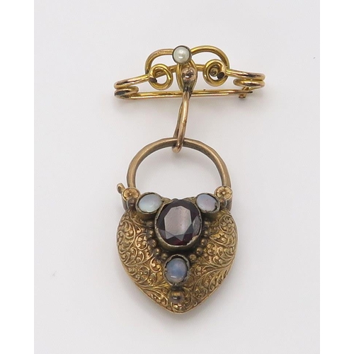 653 - A large heart shaped locket back clasp, set with moonstone and garnet, a 9ct citrine set brooch and ... 