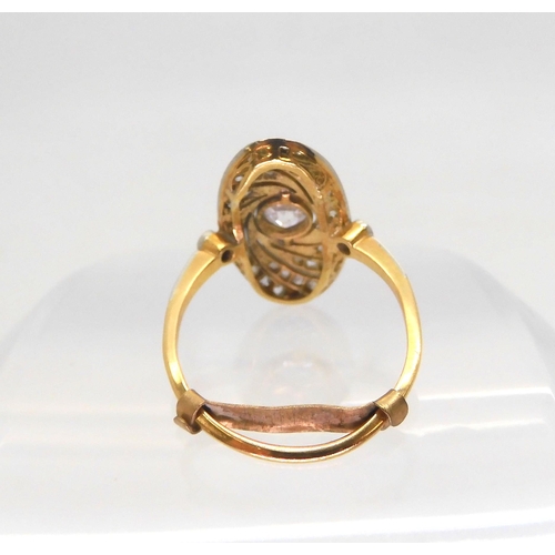 654 - A vintage diamond panel ring, with a milgrain swirl design, mounted in bright yellow and white metal... 