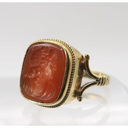 655 - A 9ct gold intaglio ring set with a carnelian carved with a maiden, finger size P, weight 4.2gms