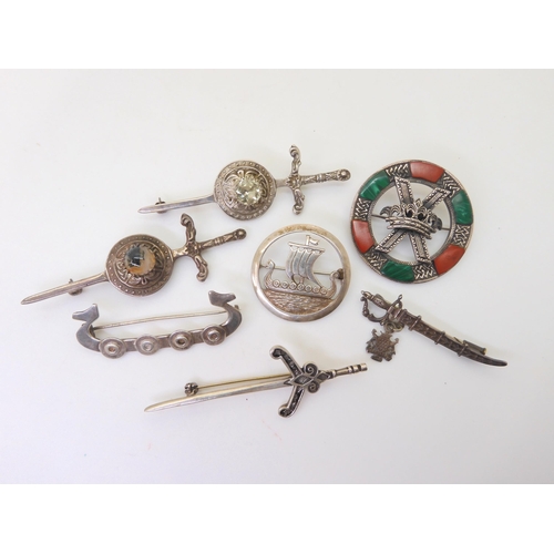 793 - Two Robert Alison sword brooches, an Ola Gorie longship brooch, items by Malcolm Gray etc