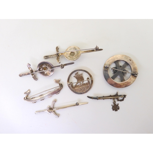 793 - Two Robert Alison sword brooches, an Ola Gorie longship brooch, items by Malcolm Gray etc