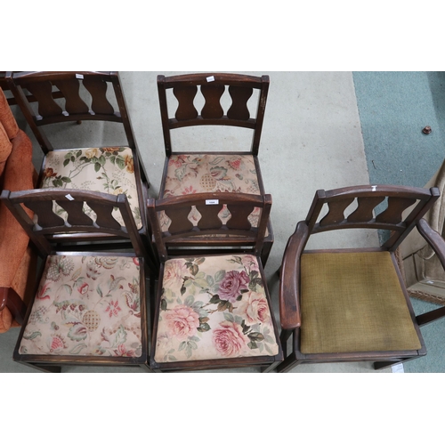 104 - A lot of five mid 20th century early Ercol elm dining chairs with pierced splats over upholstered se... 