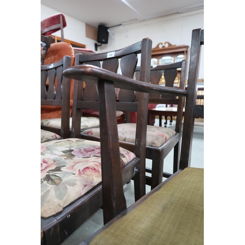 104 - A lot of five mid 20th century early Ercol elm dining chairs with pierced splats over upholstered se... 