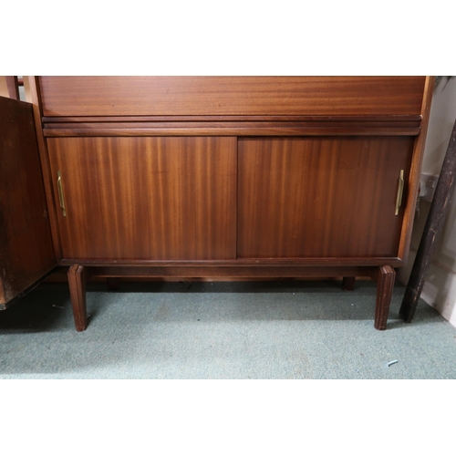 112 - A mid 20th century stained teak bureau with fall front writing compartment over sliding doors, 101cm... 