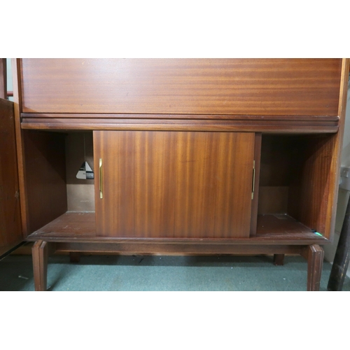 112 - A mid 20th century stained teak bureau with fall front writing compartment over sliding doors, 101cm... 